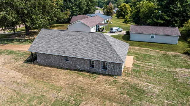swimming pool view with a garden