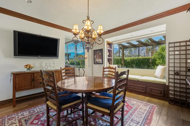 a view of a livingroom with furniture and a floor to ceiling window