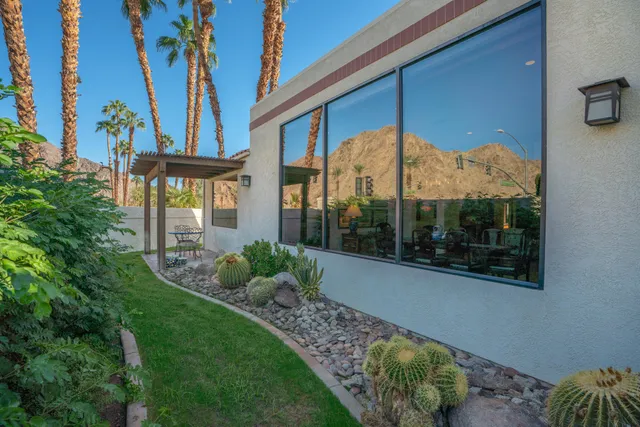 a view of a garden with an outdoor seating