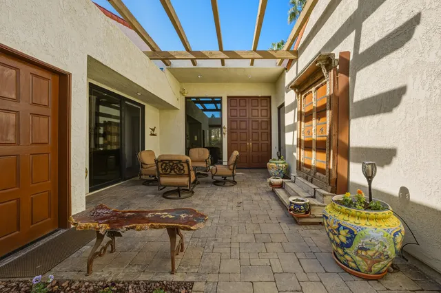 a room with gym equipment and a large window