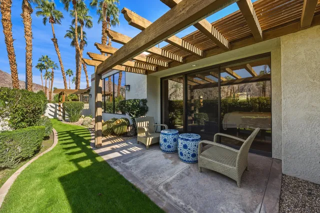 a view of a couches in patio of back yard