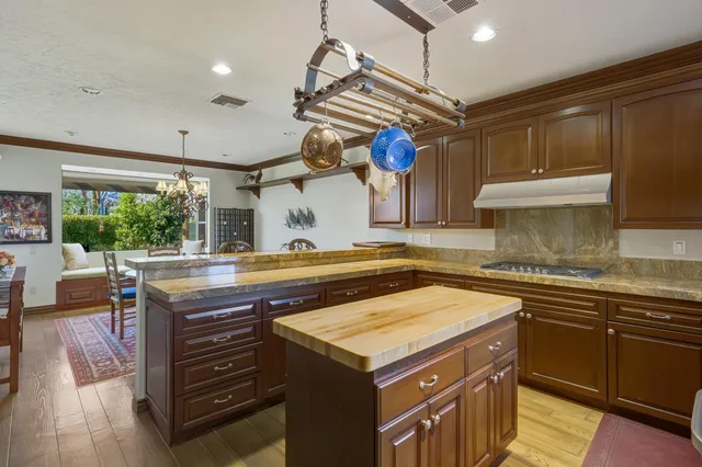 a kitchen with a stove and a sink