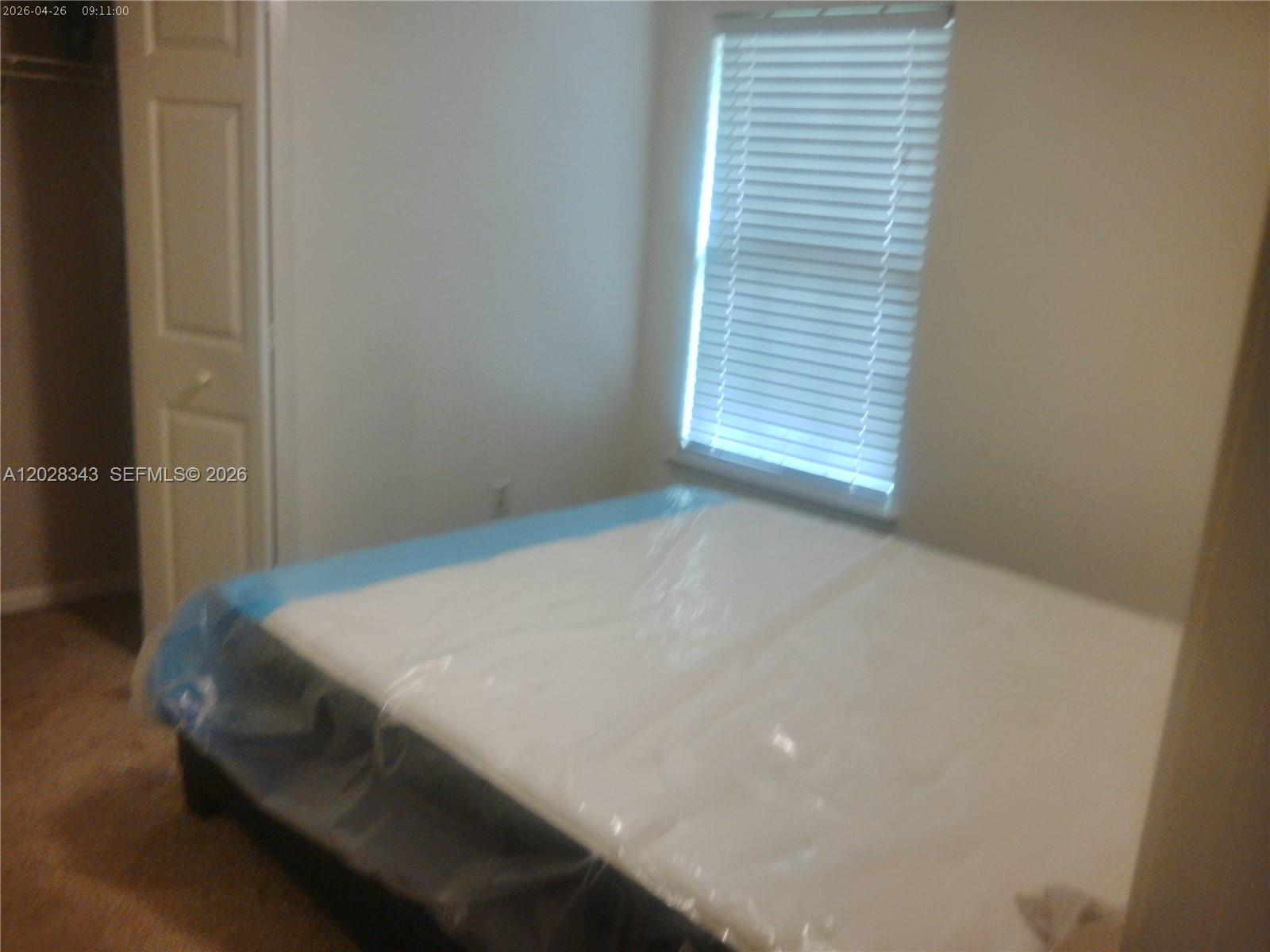 1641 Spring Oaks Lane Jacksonville, FL 32221 - Photo 18 of 44 a bed sitting in a bedroom next to a window