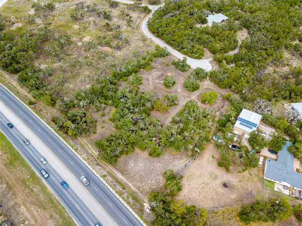 a view of a yard with a tree