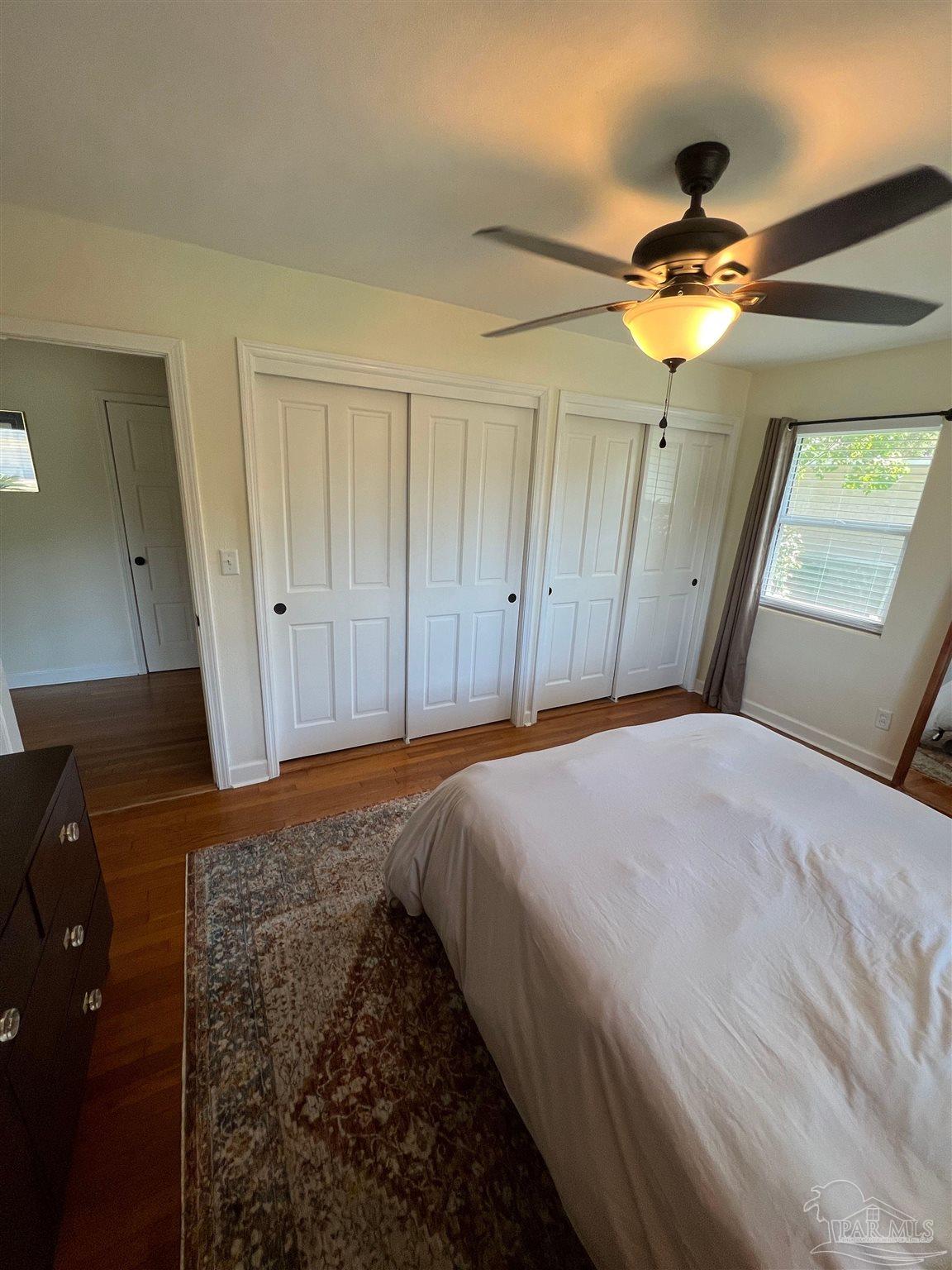320 Gamarra Road Pensacola, FL 32503 - Photo 16 of 29 a bedroom with a bed and a chandelier