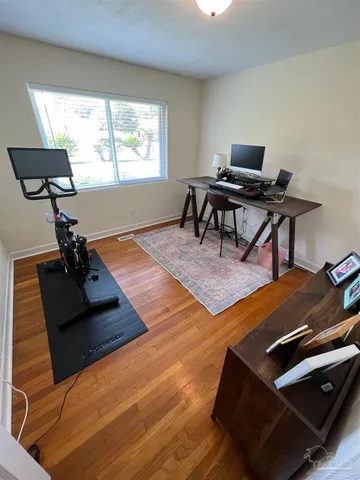 a living room with furniture rug and a window