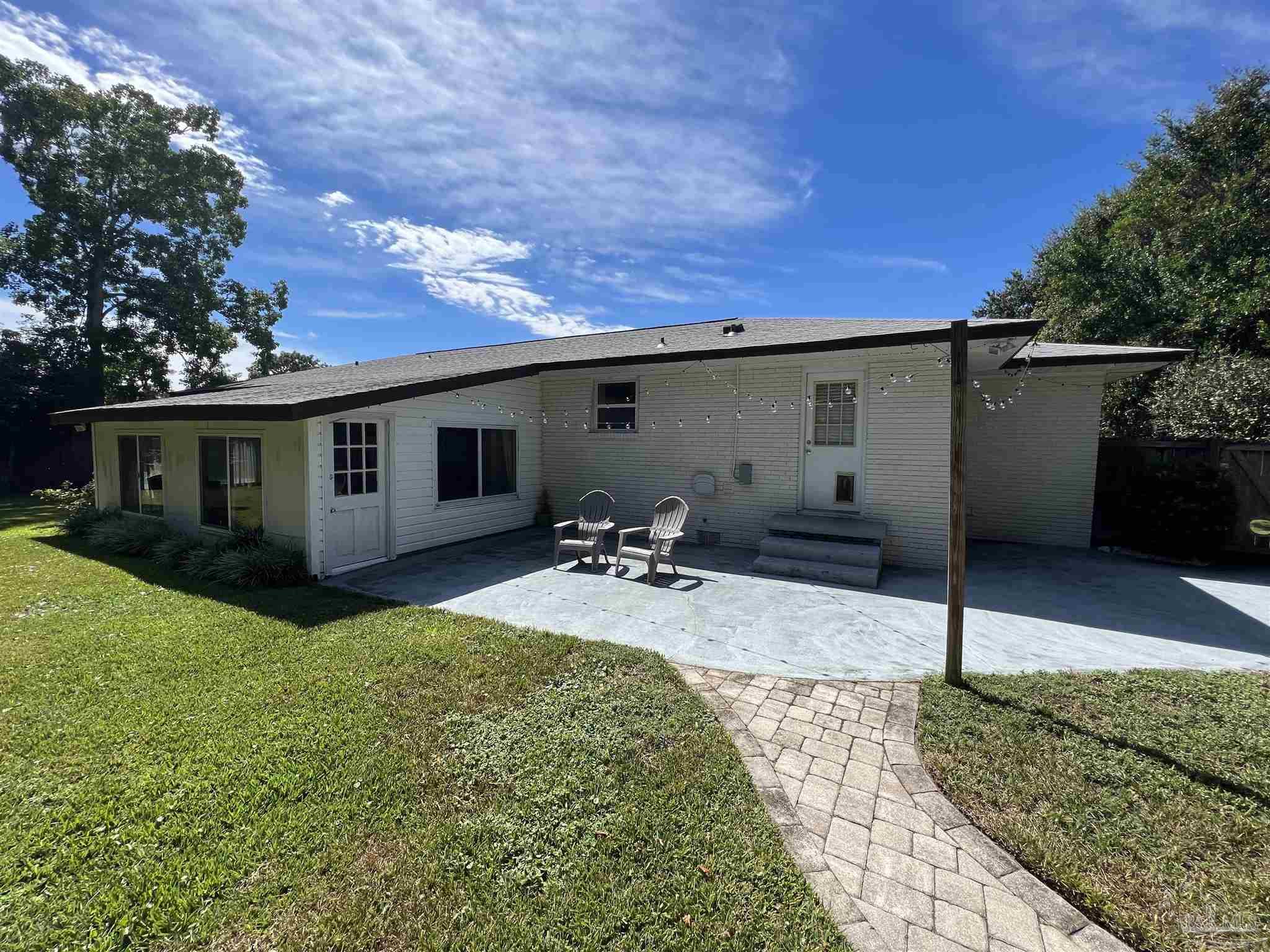320 Gamarra Road Pensacola, FL 32503 - Photo 27 of 29 a view of a house with backyard and sitting area