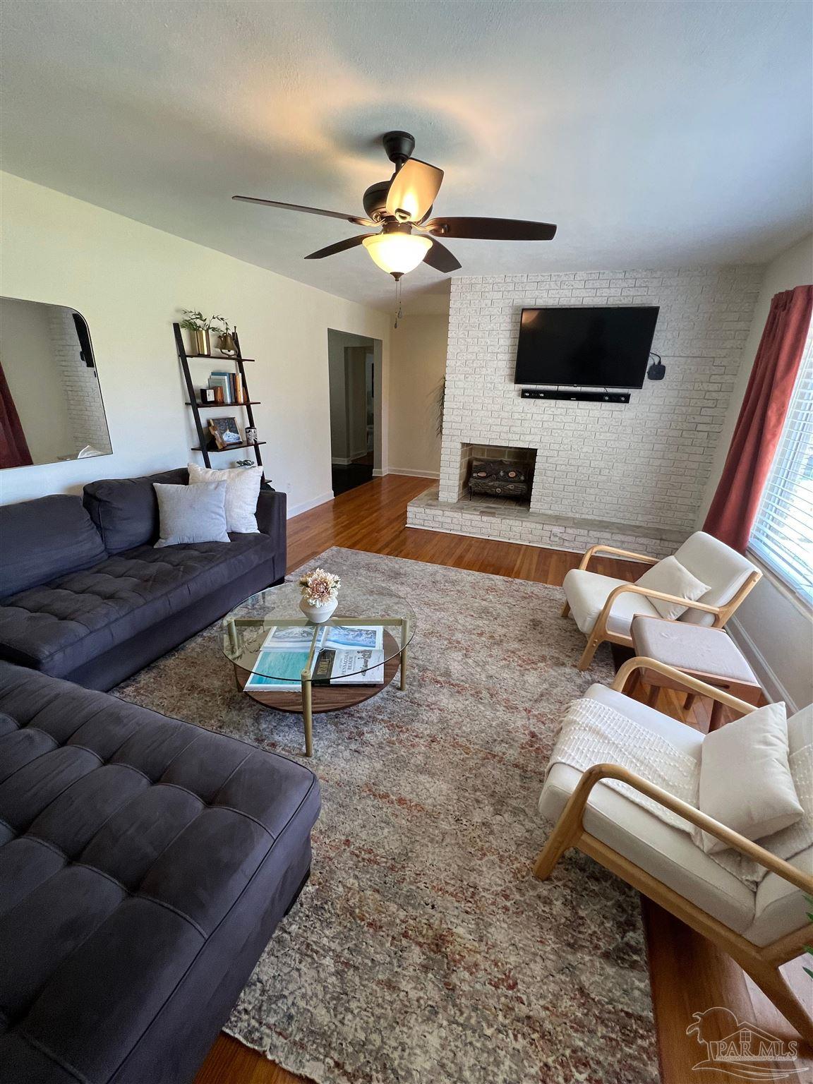 320 Gamarra Road Pensacola, FL 32503 - Photo 4 of 29 a living room with furniture and a flat screen tv