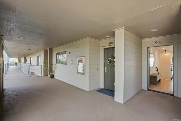 a view of a hallway with bathroom