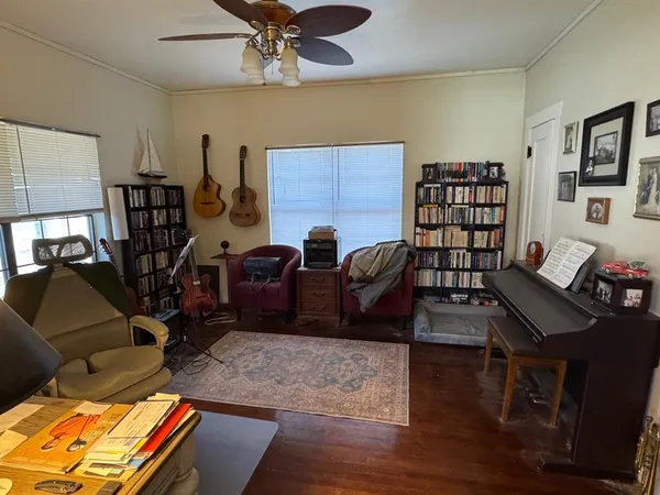 a living room with furniture or couch and a bookshelf