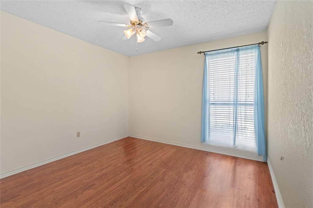 3506 Ruidoso Drive Arlington, TX 76017 - Photo 31 of 37 Bright interior room featuring wood-finish flooring, a ceiling fan with integrated lighting, and a window fitted with blinds