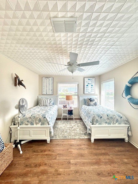 604 Maple Street Port O'Connor, TX 77982 - Photo 21 of 46 a bedroom with a bed mirror and window