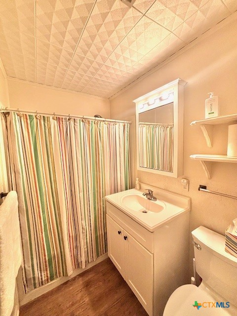 604 Maple Street Port O'Connor, TX 77982 - Photo 23 of 46 a bathroom with a granite countertop sink and a mirror