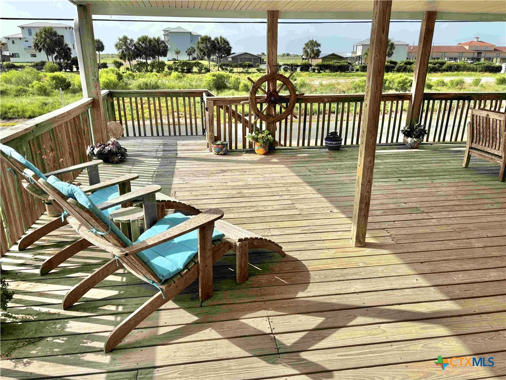 604 Maple Street Port O'Connor, TX 77982 - Photo 3 of 46 a view of a balcony with wooden floor
