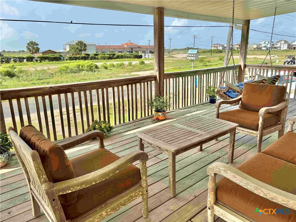 604 Maple Street Port O'Connor, TX 77982 - Photo 5 of 46 a balcony with wooden floor