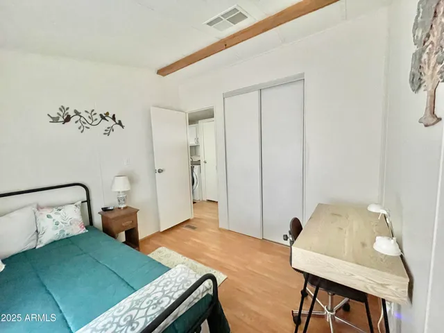 a bedroom with a bed and a table in it