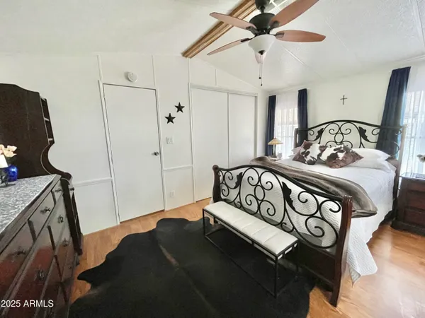 a bedroom with a bed and a dresser