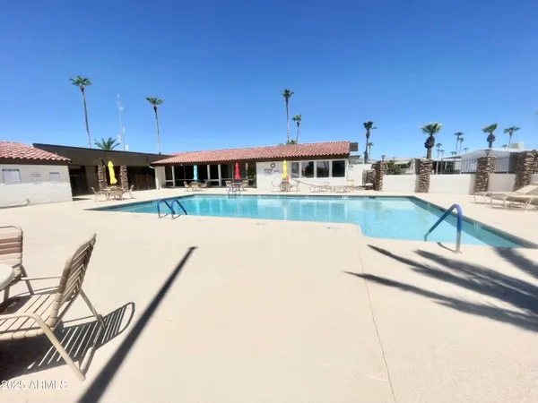 a bedroom with furniture and a flat screen tv