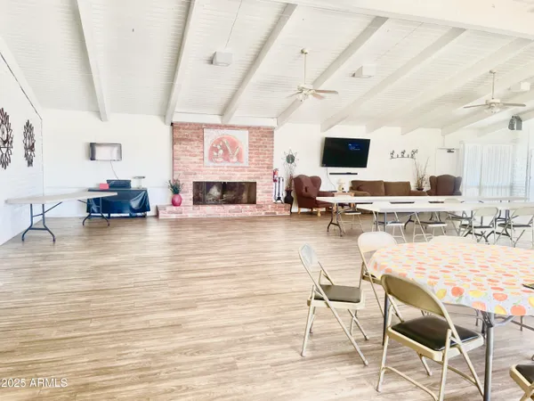 a spacious bathroom with a double vanity sink a large mirror and a shower