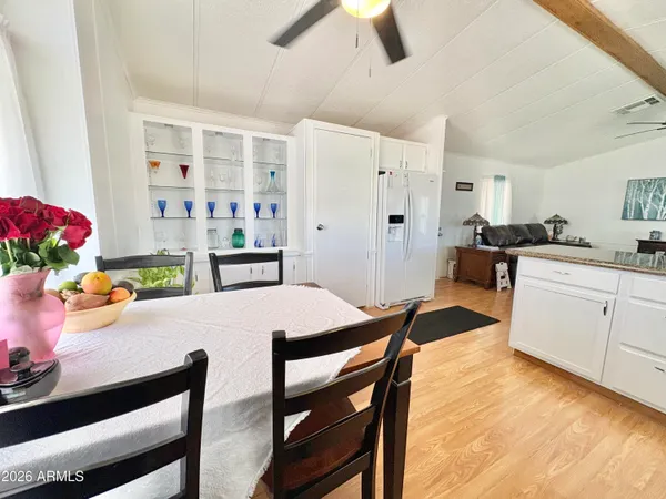 a kitchen with a table and cabinets