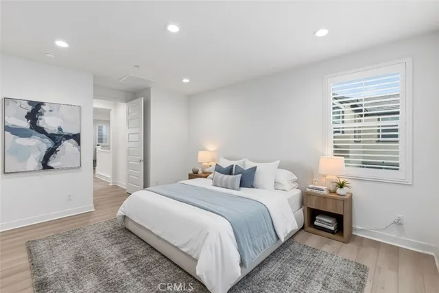 a bedroom with a bed and a walk in closet