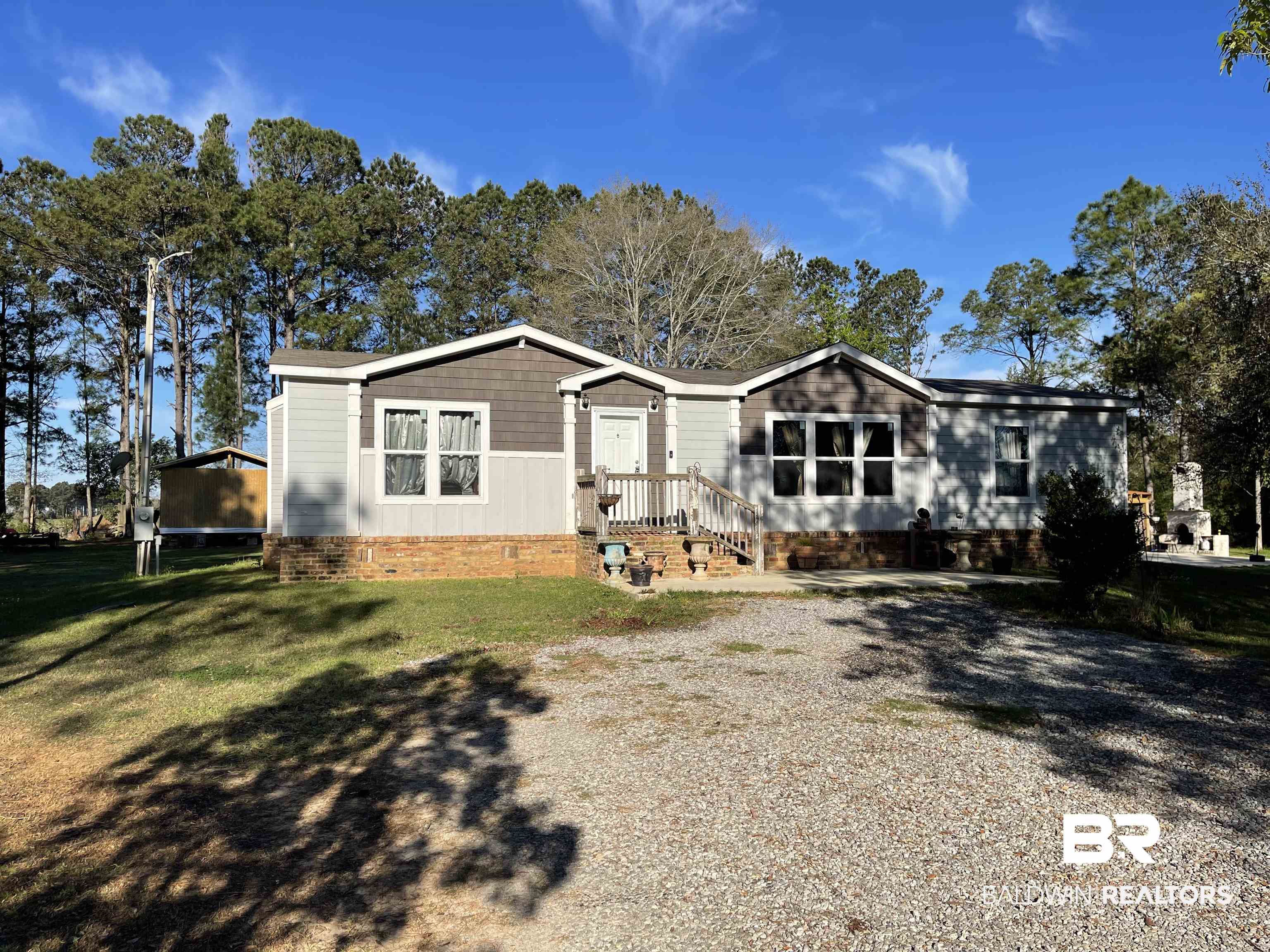 21593 Hubbard Road Robertsdale, AL 36567 - Photo 1 of 22 Manufactured / mobile home featuring a front yard and crawl space