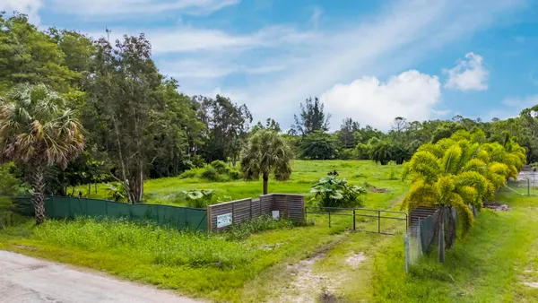 a view of a garden with houses