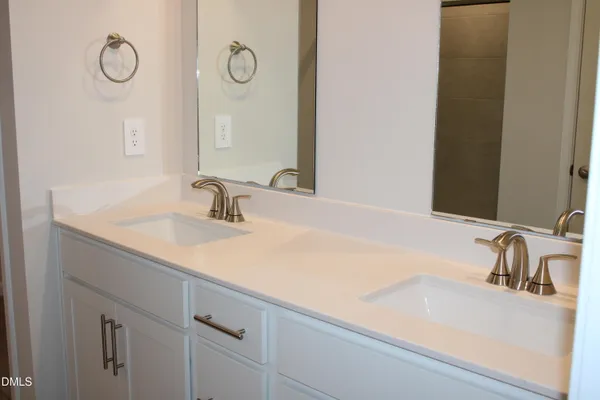 a bathroom with a sink and a large mirror