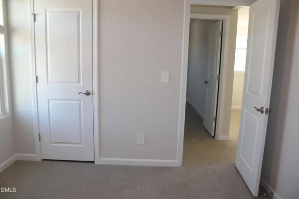 an empty room and closet area