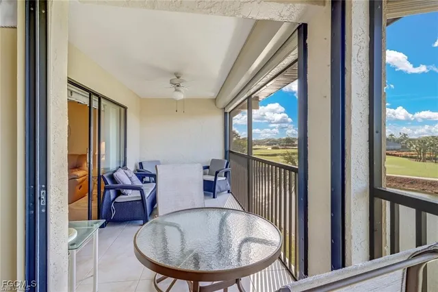 a front view of house with yard and trees