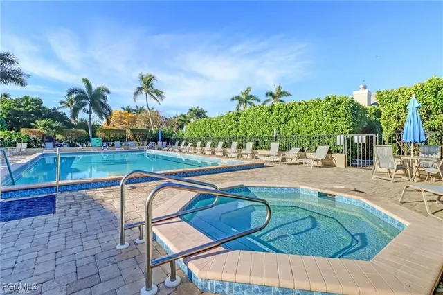 a view of a house with pool and a yard