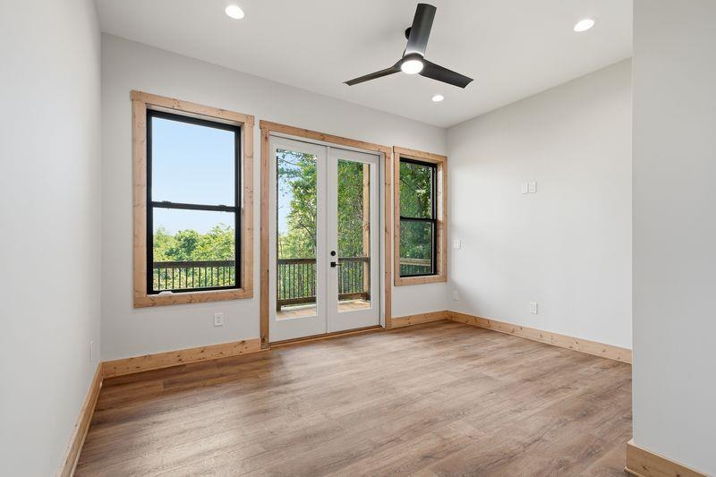 216 Old Orchard Road Ellijay, GA 30536 - Photo 28 of 59 a view of an empty room with a window and wooden floor