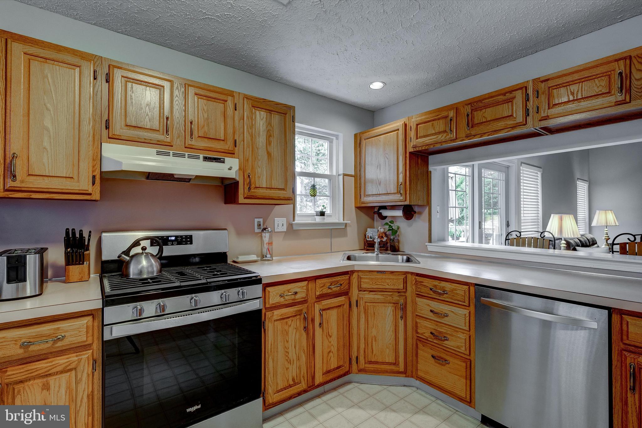 105 Annapolis Drive Sicklerville, NJ 08081 - Photo 11 of 56 a kitchen with a sink stove and cabinets