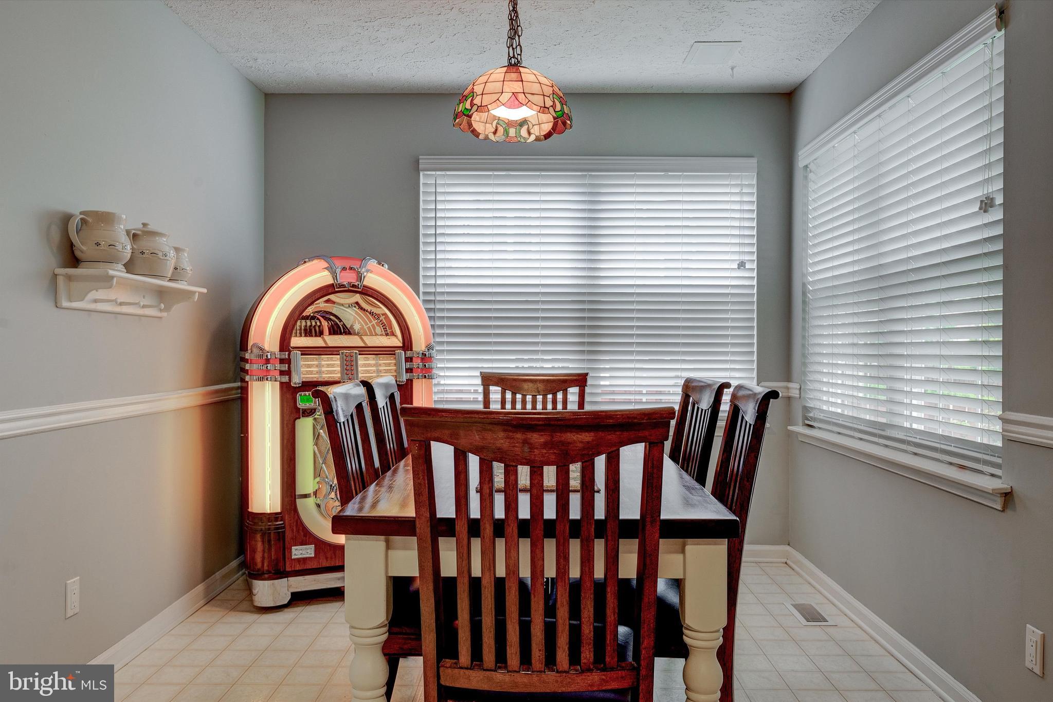 105 Annapolis Drive Sicklerville, NJ 08081 - Photo 13 of 56 a view of a dining room with furniture and a window