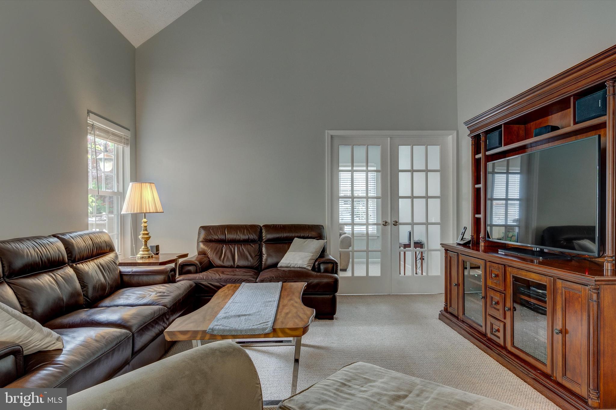 105 Annapolis Drive Sicklerville, NJ 08081 - Photo 17 of 56 a living room with furniture and a flat screen tv