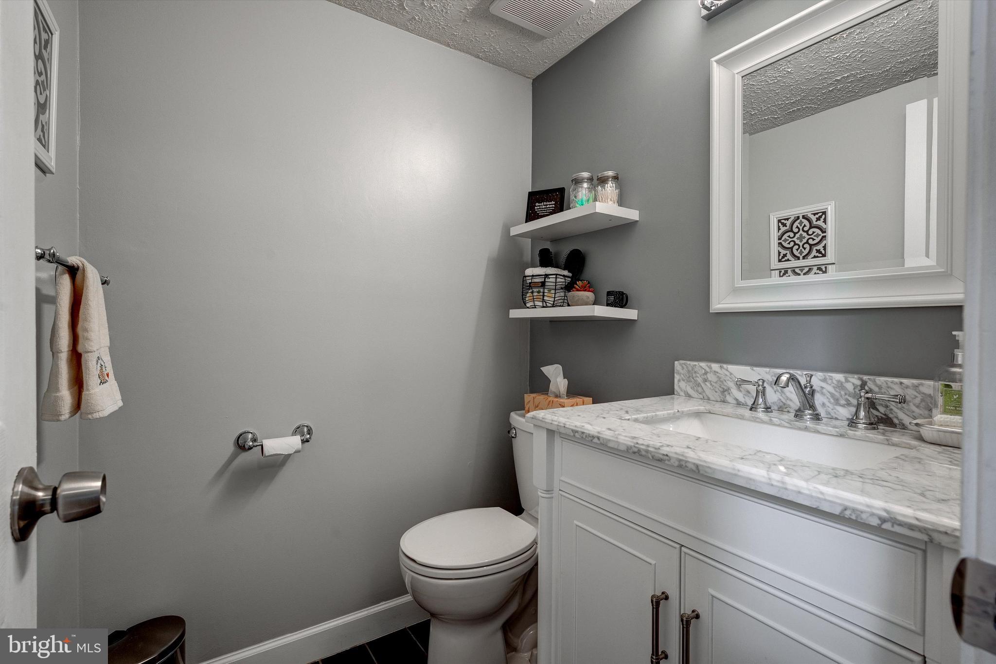 105 Annapolis Drive Sicklerville, NJ 08081 - Photo 21 of 56 a bathroom with a sink toilet and vanity