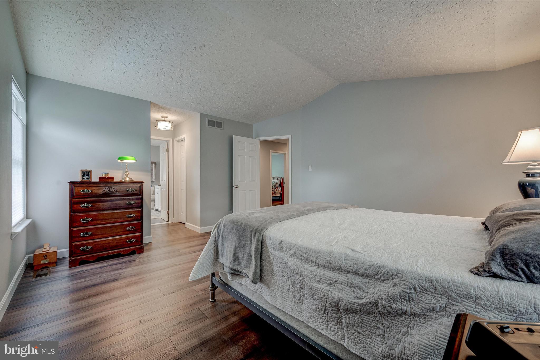 105 Annapolis Drive Sicklerville, NJ 08081 - Photo 26 of 56 a bedroom with a bed and a dresser