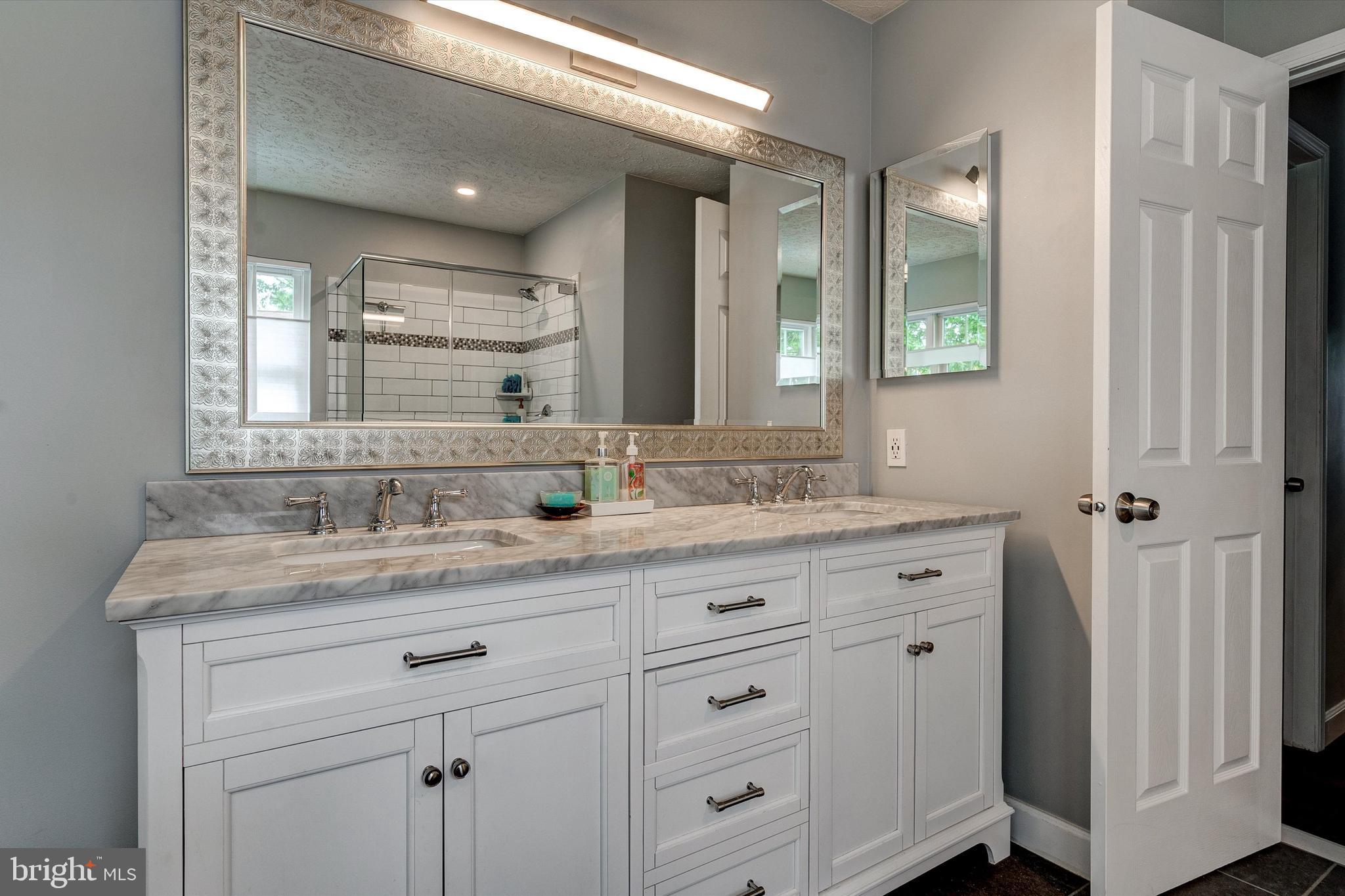 105 Annapolis Drive Sicklerville, NJ 08081 - Photo 29 of 56 a bathroom with a granite countertop sink mirror and double