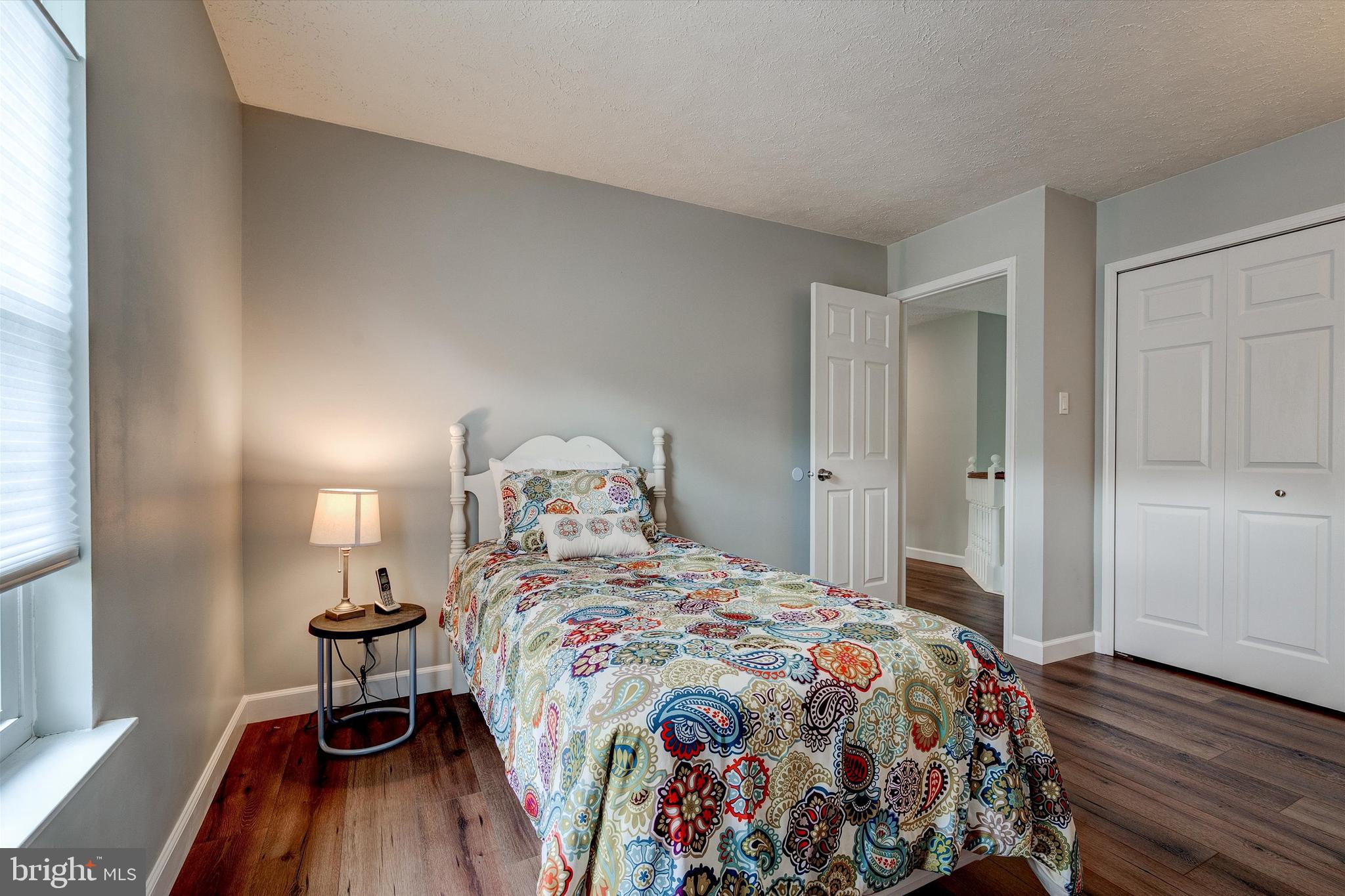 105 Annapolis Drive Sicklerville, NJ 08081 - Photo 33 of 56 a bedroom with a bed and wooden floor