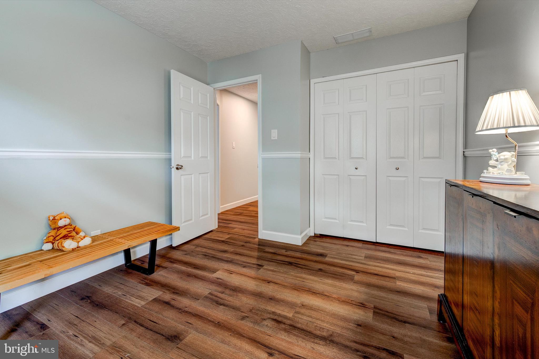 105 Annapolis Drive Sicklerville, NJ 08081 - Photo 35 of 56 a living room with wooden floor and furniture