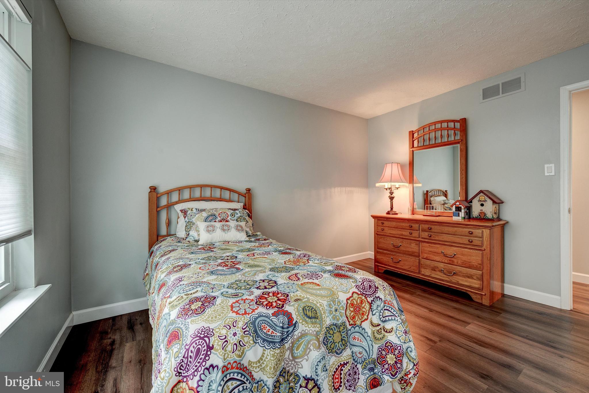 105 Annapolis Drive Sicklerville, NJ 08081 - Photo 37 of 56 a bedroom with a bed and a dresser in it