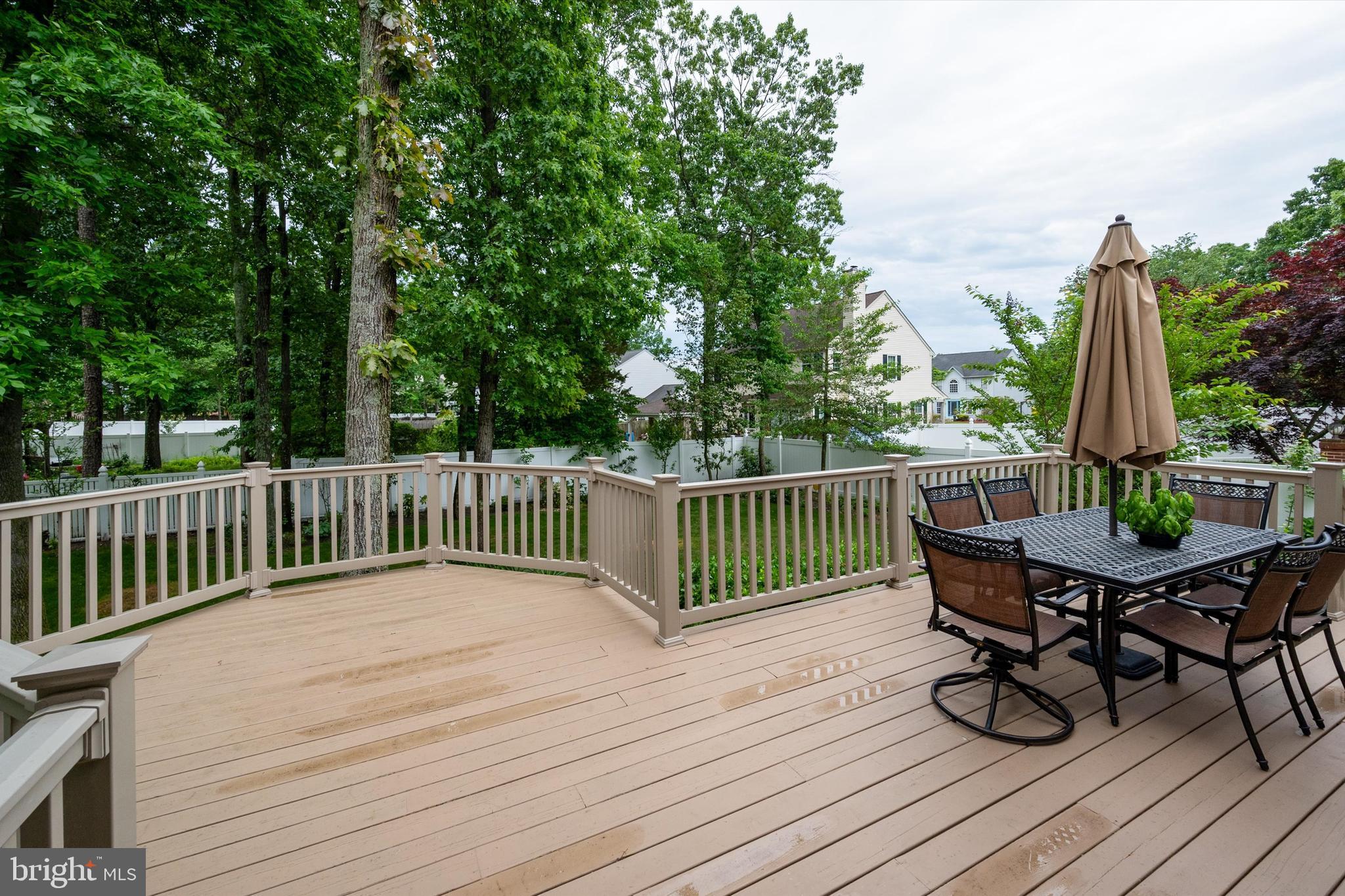105 Annapolis Drive Sicklerville, NJ 08081 - Photo 50 of 56 a view of a deck with furniture and wooden floor