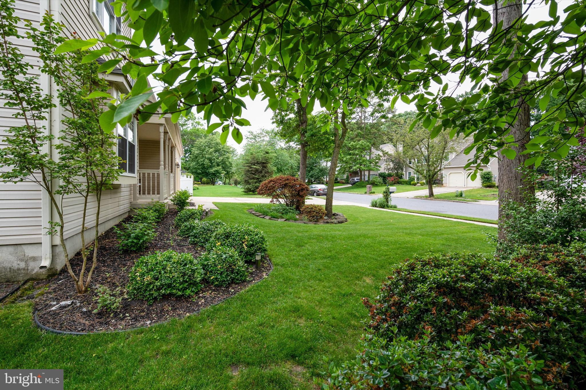 105 Annapolis Drive Sicklerville, NJ 08081 - Photo 5 of 56 a view of a backyard with large trees