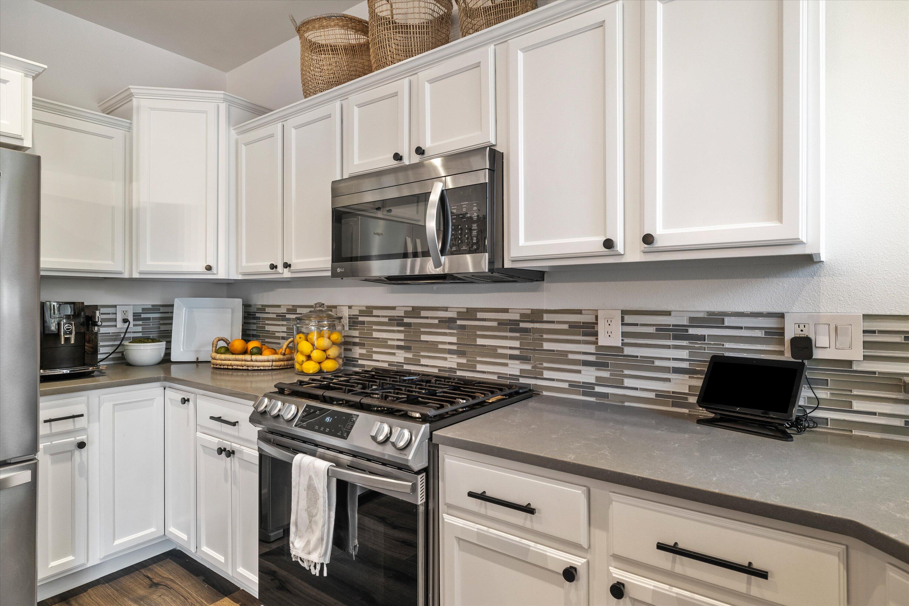 61269 Southwest Brookside Loop Bend, OR 97702 - Photo 20 of 46 Beautiful quartz countertops with tile backsplash