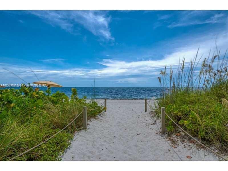 1111 Crandon Boulevard, Unit B804 Key Biscayne, FL 33149 - Photo 11 of 19 a view of a yard with wooden fence