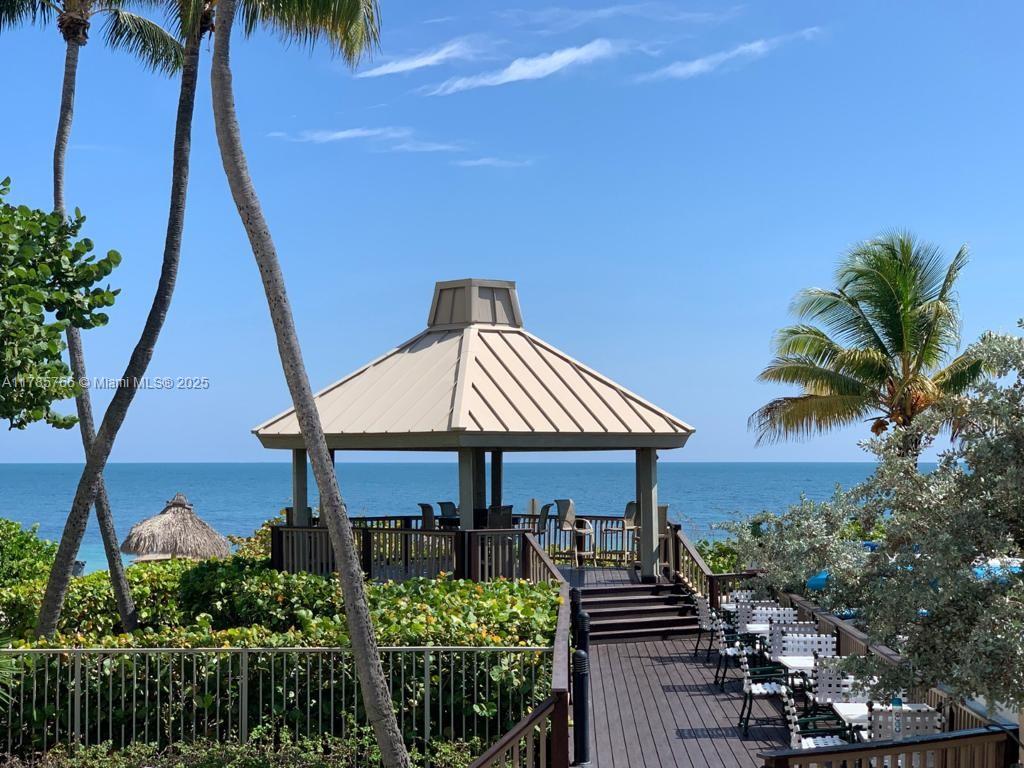 1111 Crandon Boulevard, Unit B804 Key Biscayne, FL 33149 - Photo 17 of 19 a front view of a house with a garden