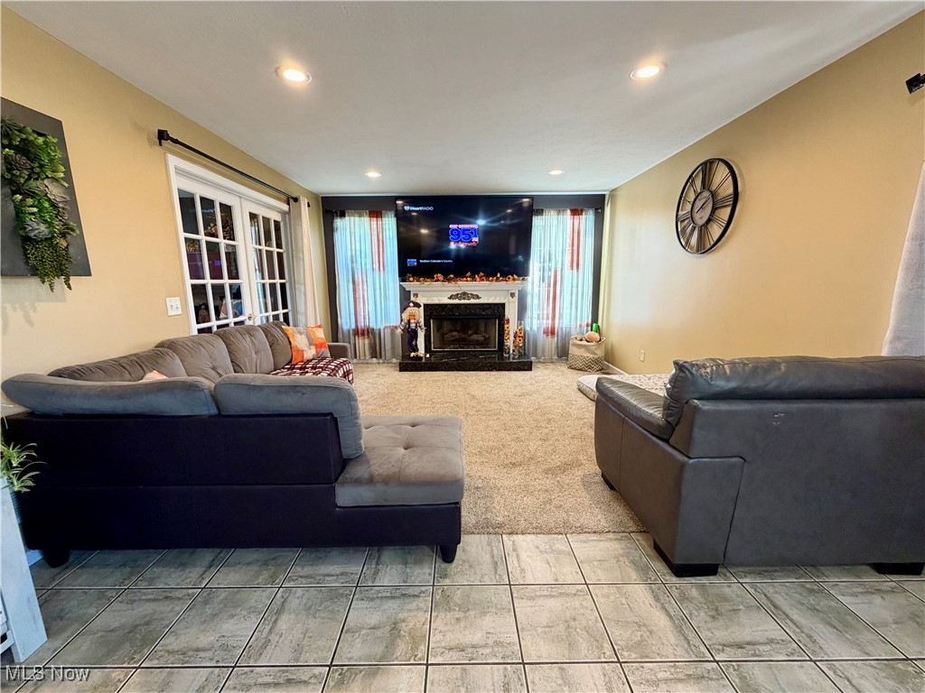 7374 Virginia Road Atwater, OH 44201 - Photo 14 of 49 Living room featuring a fireplace with raised hearth and recessed lighting