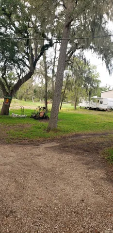 a view of outdoor space with deck and trees