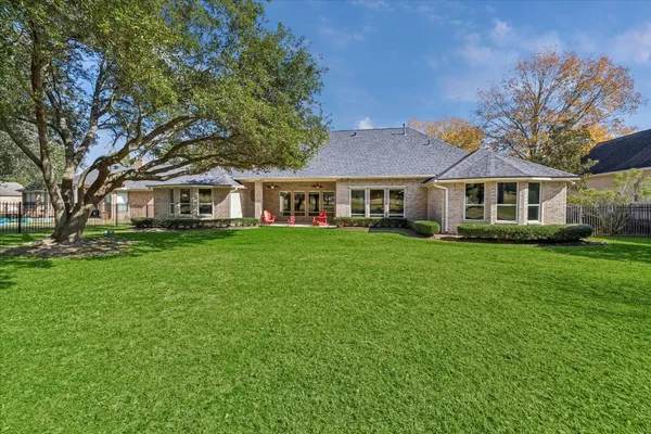 a front view of a house with a yard table and chairs