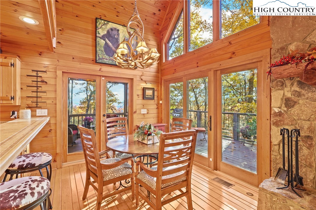 675 Cabin Ridge Road Ferguson, NC 28624 - Photo 14 of 50 a view of a patio with couches table and chairs